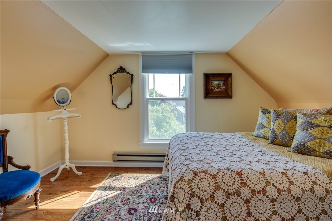 23908 24th Drive Southeast Bothell, WA 98021 - Photo 32 of 40 a bedroom with a bed and wooden floor