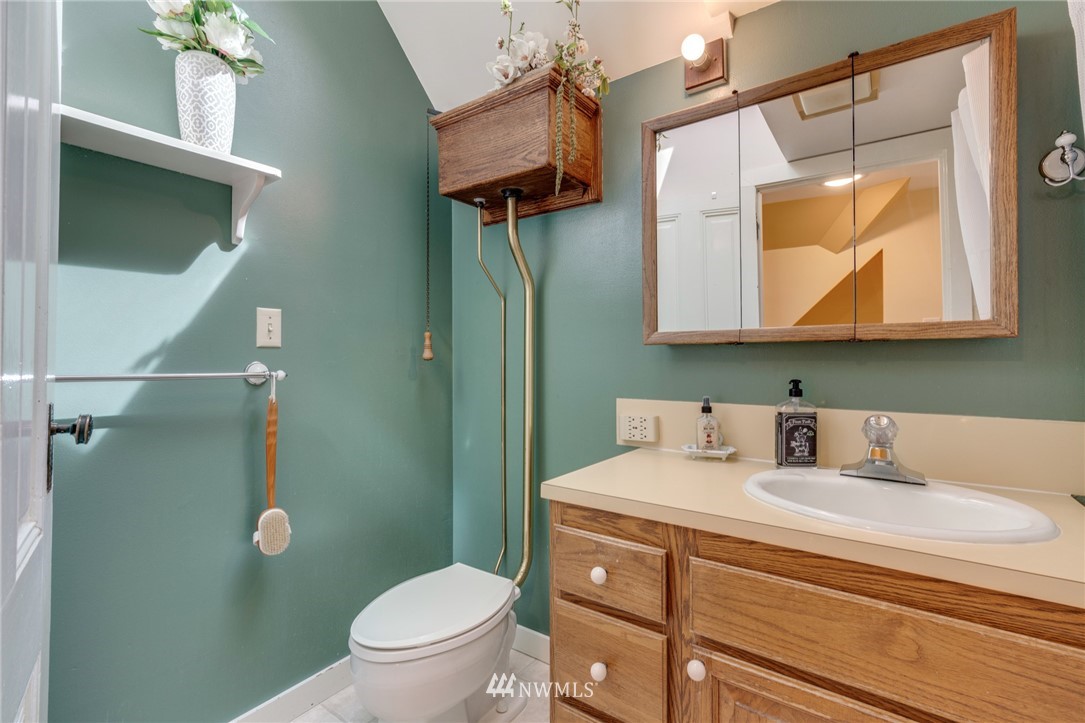 23908 24th Drive Southeast Bothell, WA 98021 - Photo 33 of 40 a bathroom with a toilet sink and mirror