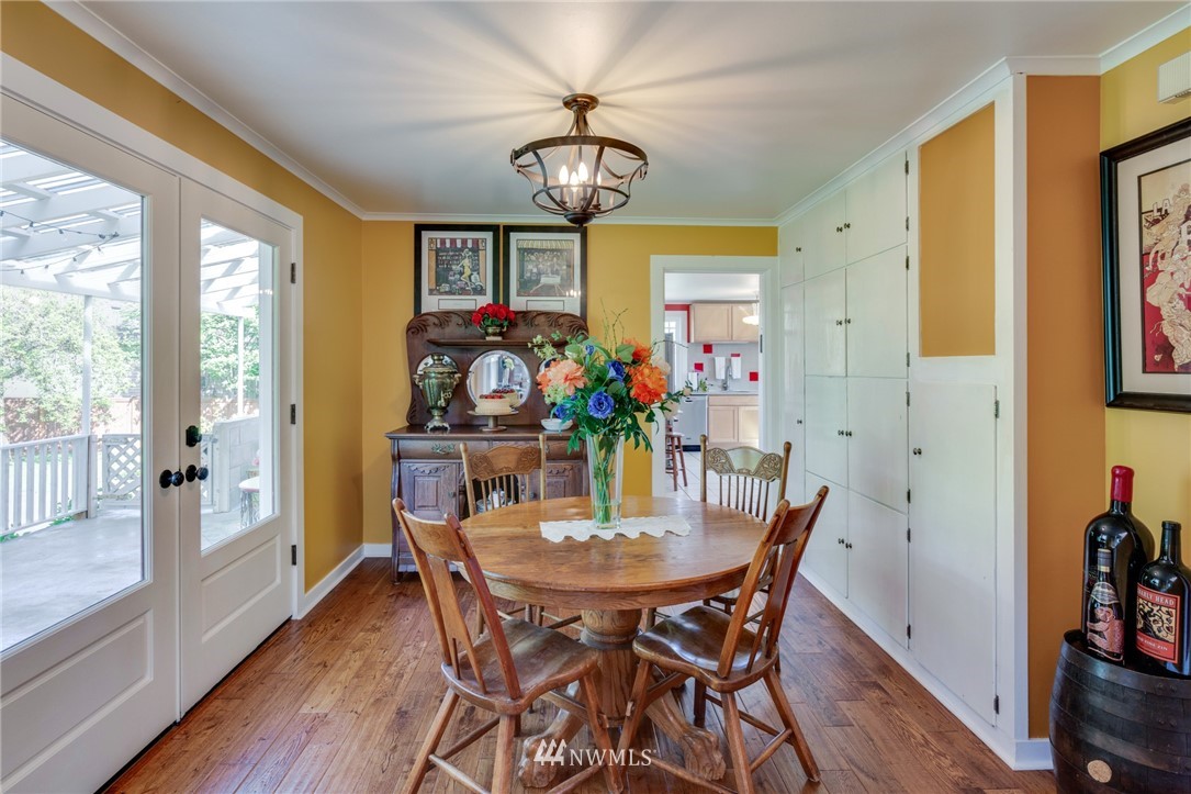 23908 24th Drive Southeast Bothell, WA 98021 - Photo 10 of 40 a view of a dining room with furniture a chandelier and wooden floor
