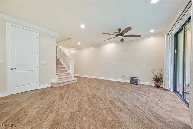 wooden floor in a hall with an empty room