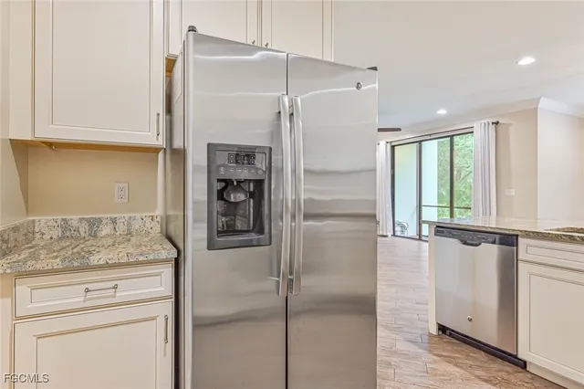 a kitchen with a refrigerator and countertop