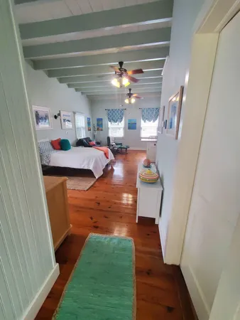 a room with kitchen island a stove and a refrigerator