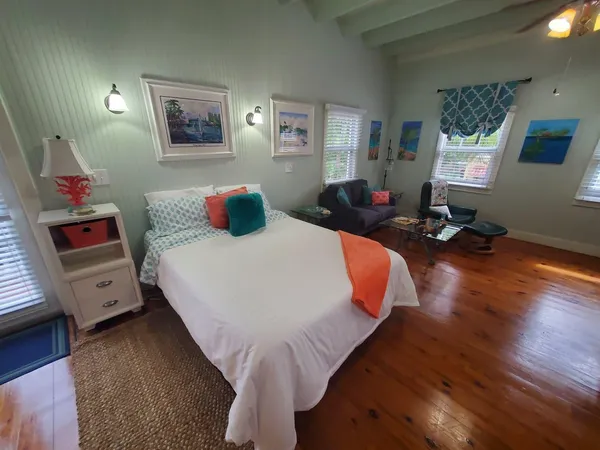 a bed sitting in a room next to a window