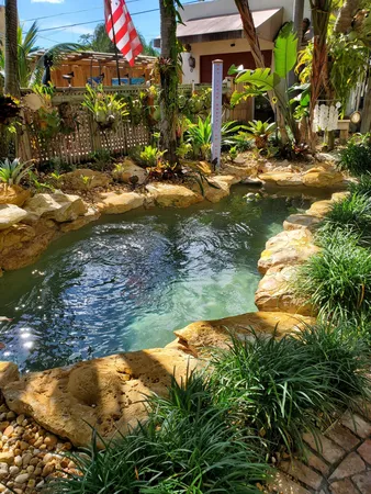a view of swimming pool with outdoor seating and lake