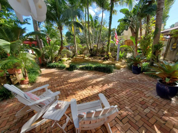 a view of yard with patio