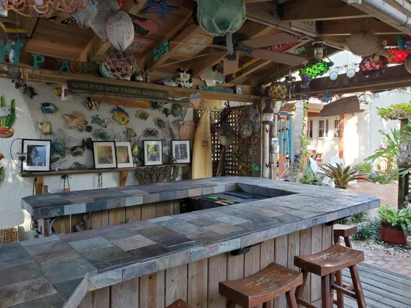 a view of a chairs and table in a patio
