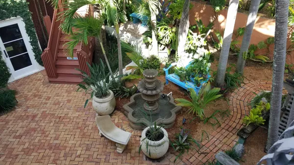 a view of a porch with furniture and a potted plant