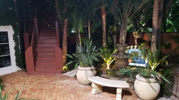 a view of a room with lots of different kinds of flowers