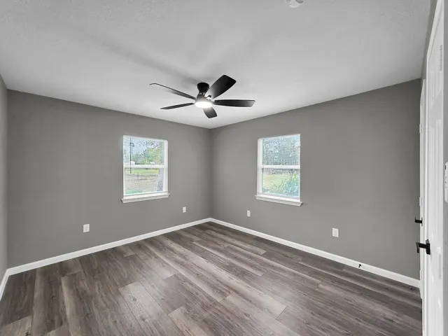 a bathroom with a toilet a sink and bathtub