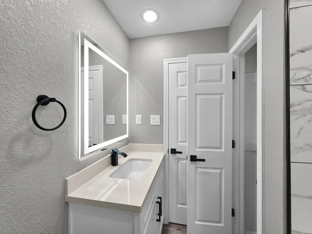 a view of an empty room with a window