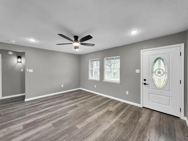 a view of an empty room with a window