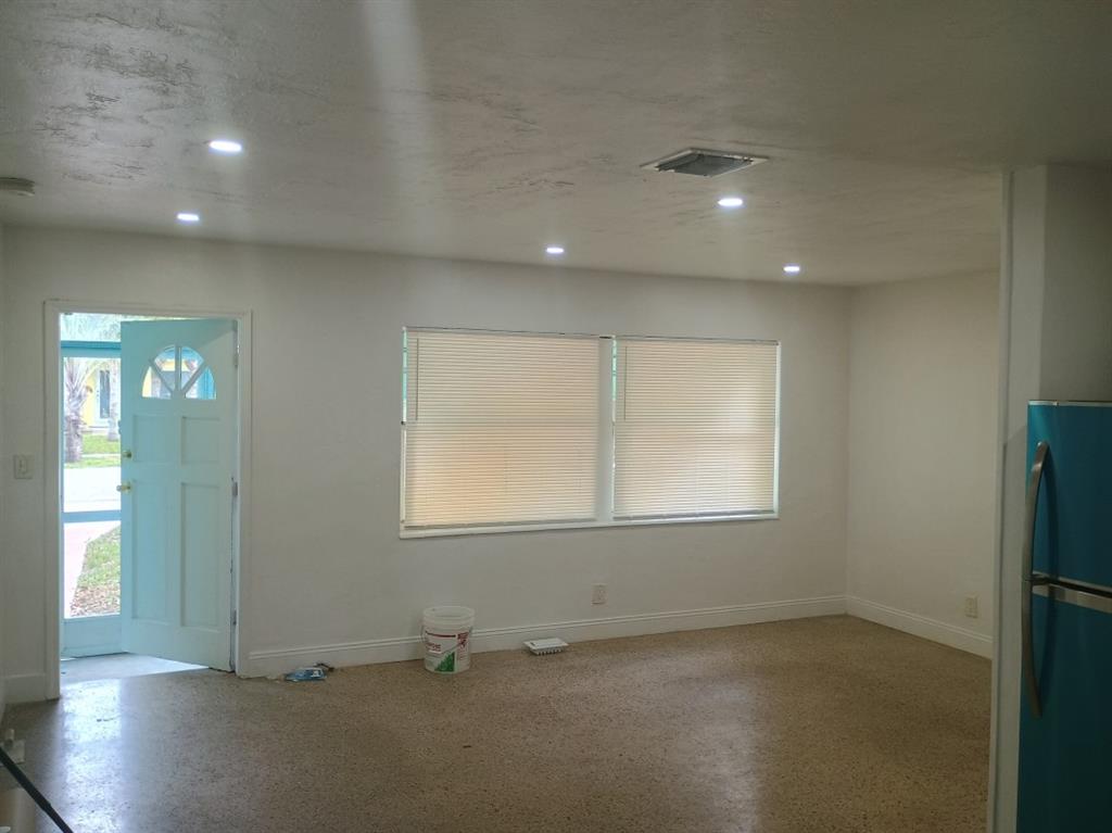 2465 Northeast 14th Avenue Pompano Beach, FL 33064 - Photo 5 of 6 an empty room with windows