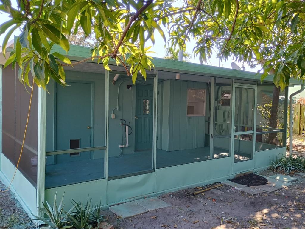 2465 Northeast 14th Avenue Pompano Beach, FL 33064 - Photo 6 of 6 a view of a house with a tree