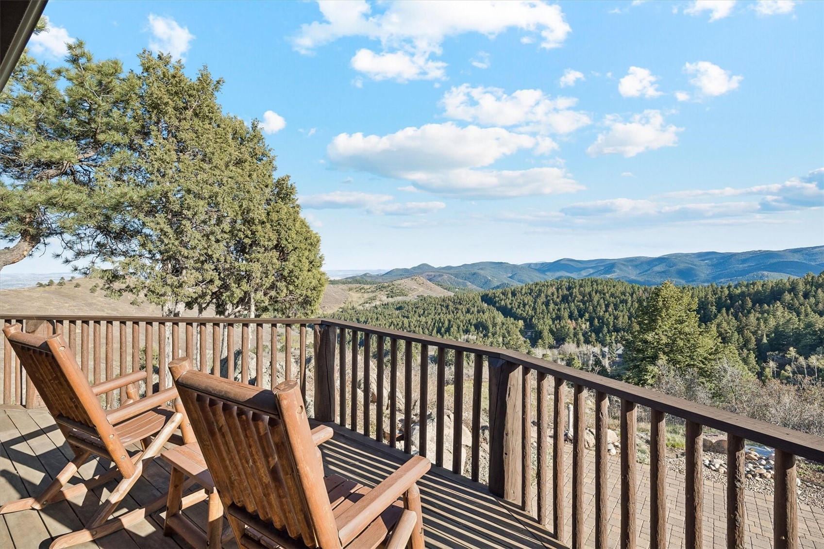 51 West Ranch Trail Morrison, CO 80465 - Photo 29 of 50 a view of a balcony with wooden fence