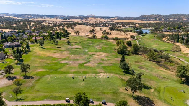a view of a town with mountains in the background