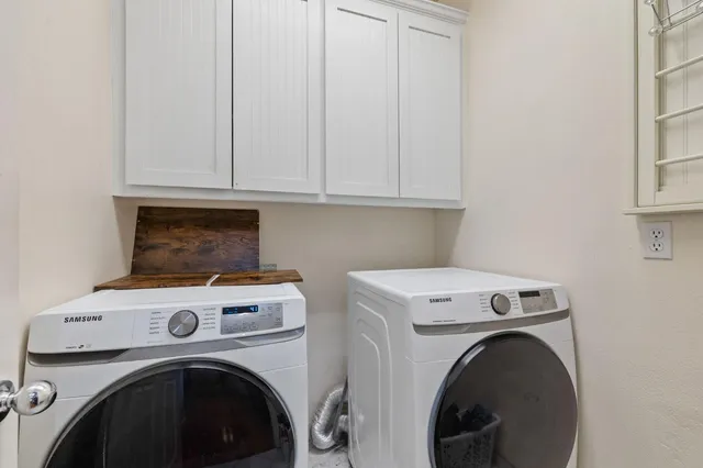 a living room with fireplace furniture and a table