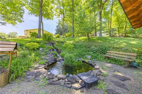 a backyard of a house with lots of green space