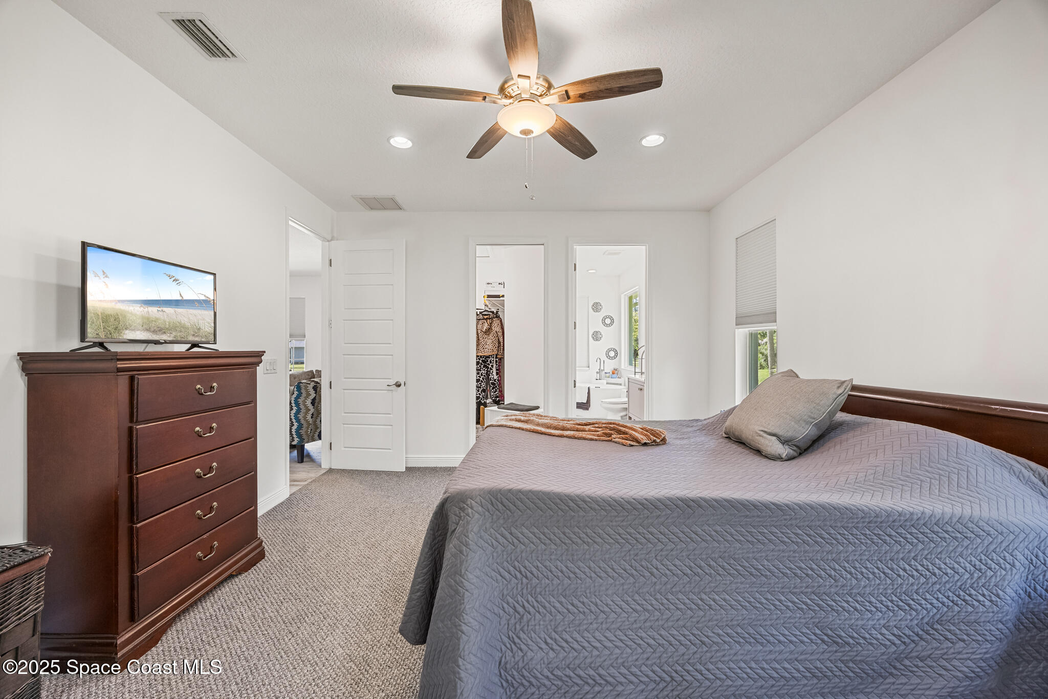 2050 Valkaria Road Grant-Valkaria, FL 32950 - Photo 16 of 56 a bedroom with a bed and a dresser