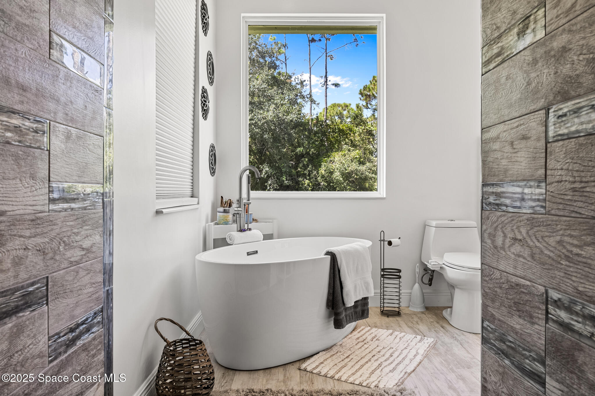 2050 Valkaria Road Grant-Valkaria, FL 32950 - Photo 17 of 56 a bathroom with a sink toilet and shower