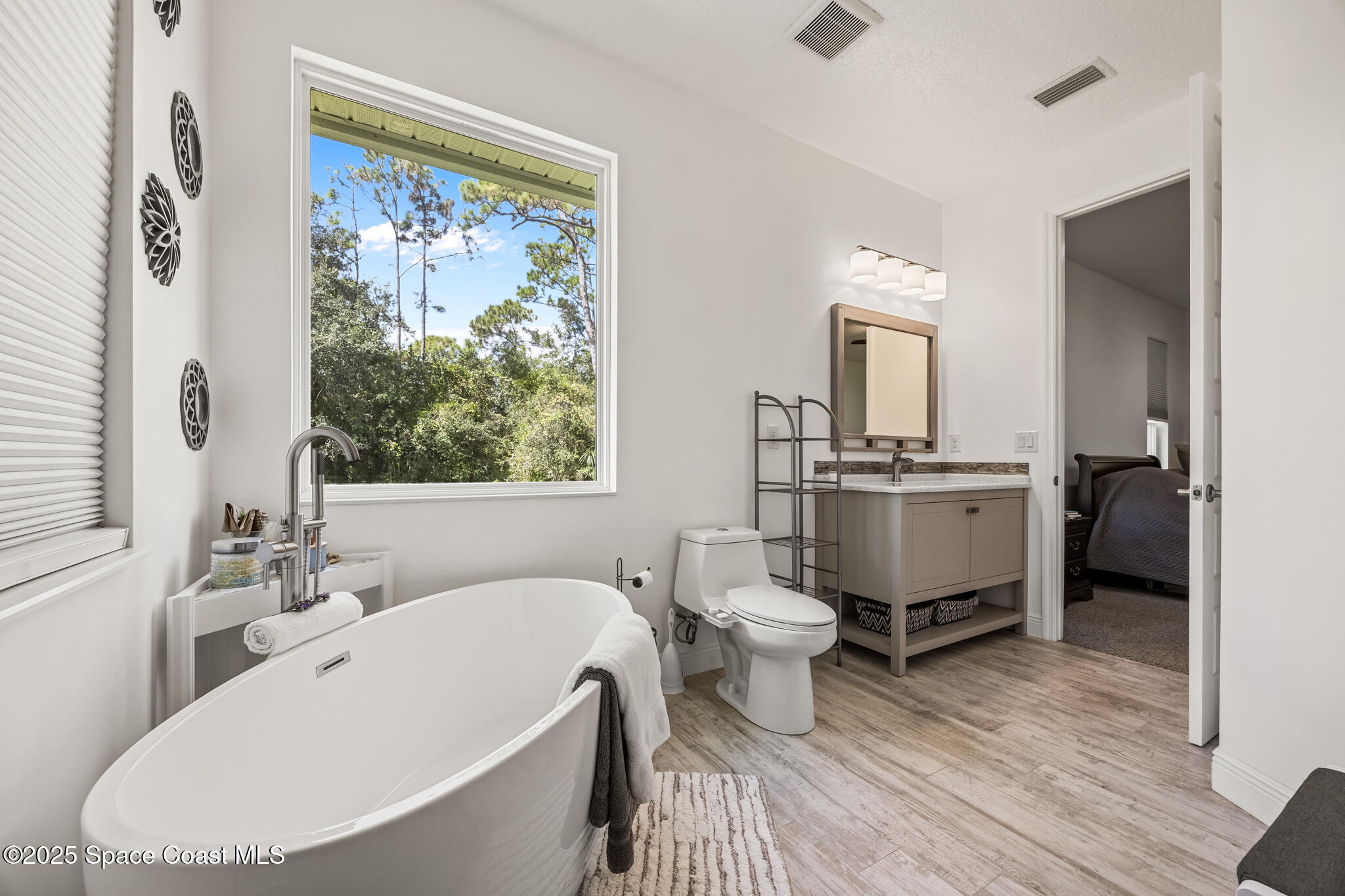 2050 Valkaria Road Grant-Valkaria, FL 32950 - Photo 21 of 56 a bathroom with a sink toilet and a mirror