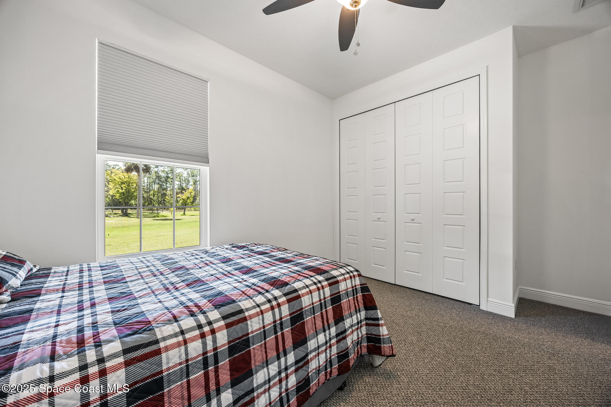 2050 Valkaria Road Grant-Valkaria, FL 32950 - Photo 24 of 56 a bedroom with a bed and a window