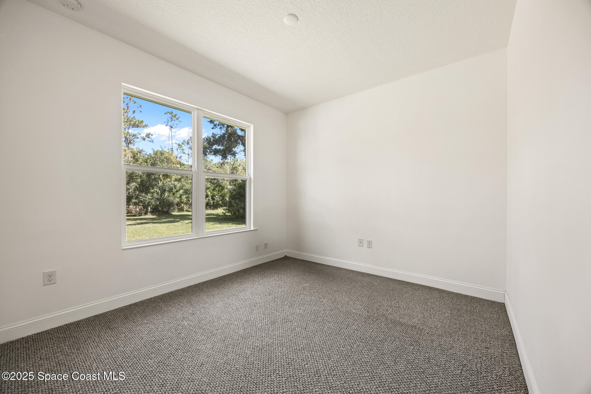 2050 Valkaria Road Grant-Valkaria, FL 32950 - Photo 25 of 56 an empty room with a window