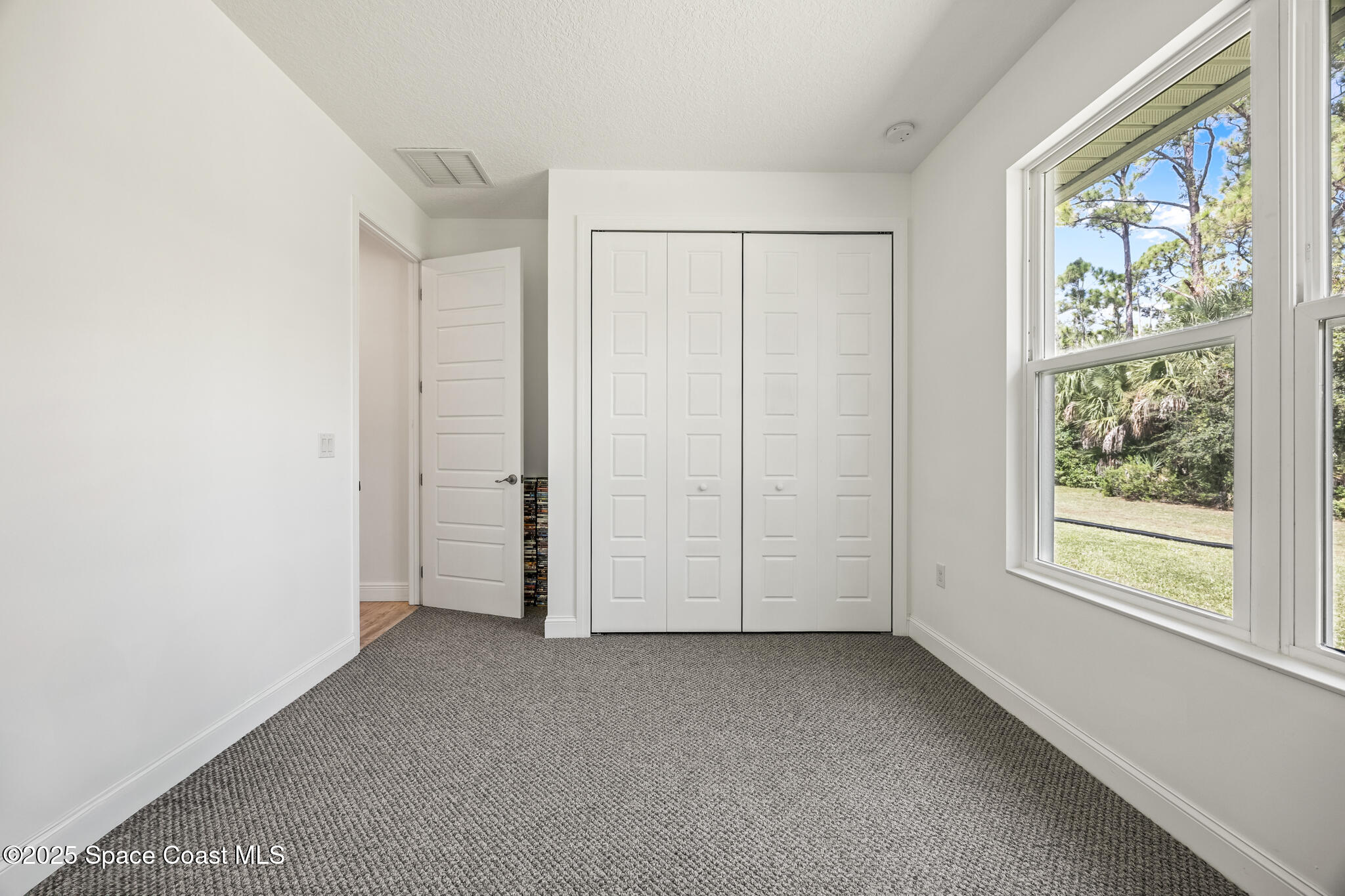 2050 Valkaria Road Grant-Valkaria, FL 32950 - Photo 26 of 56 an empty room with windows