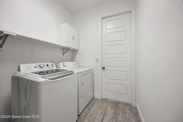 a balcony with furniture and a potted plant
