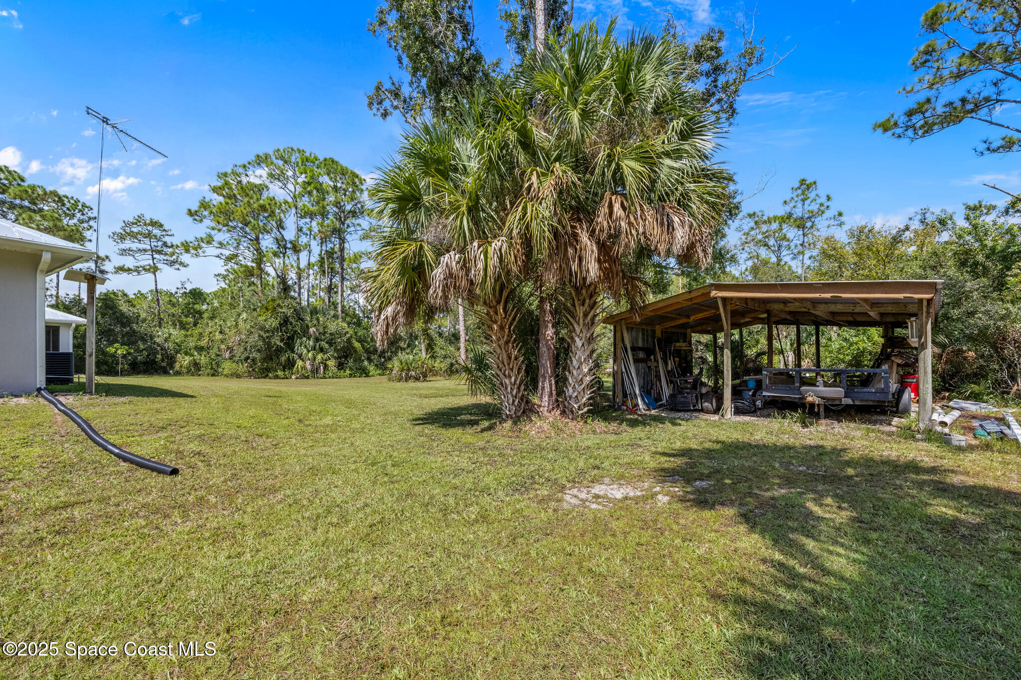 2050 Valkaria Road Grant-Valkaria, FL 32950 - Photo 32 of 56 a view of a house with basketball court