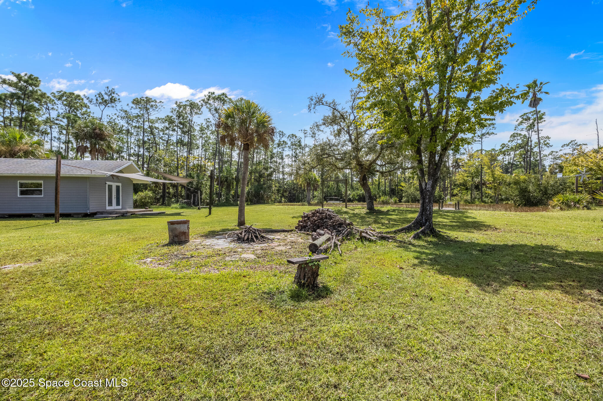 2050 Valkaria Road Grant-Valkaria, FL 32950 - Photo 33 of 56 a view of a swimming pool with a patio