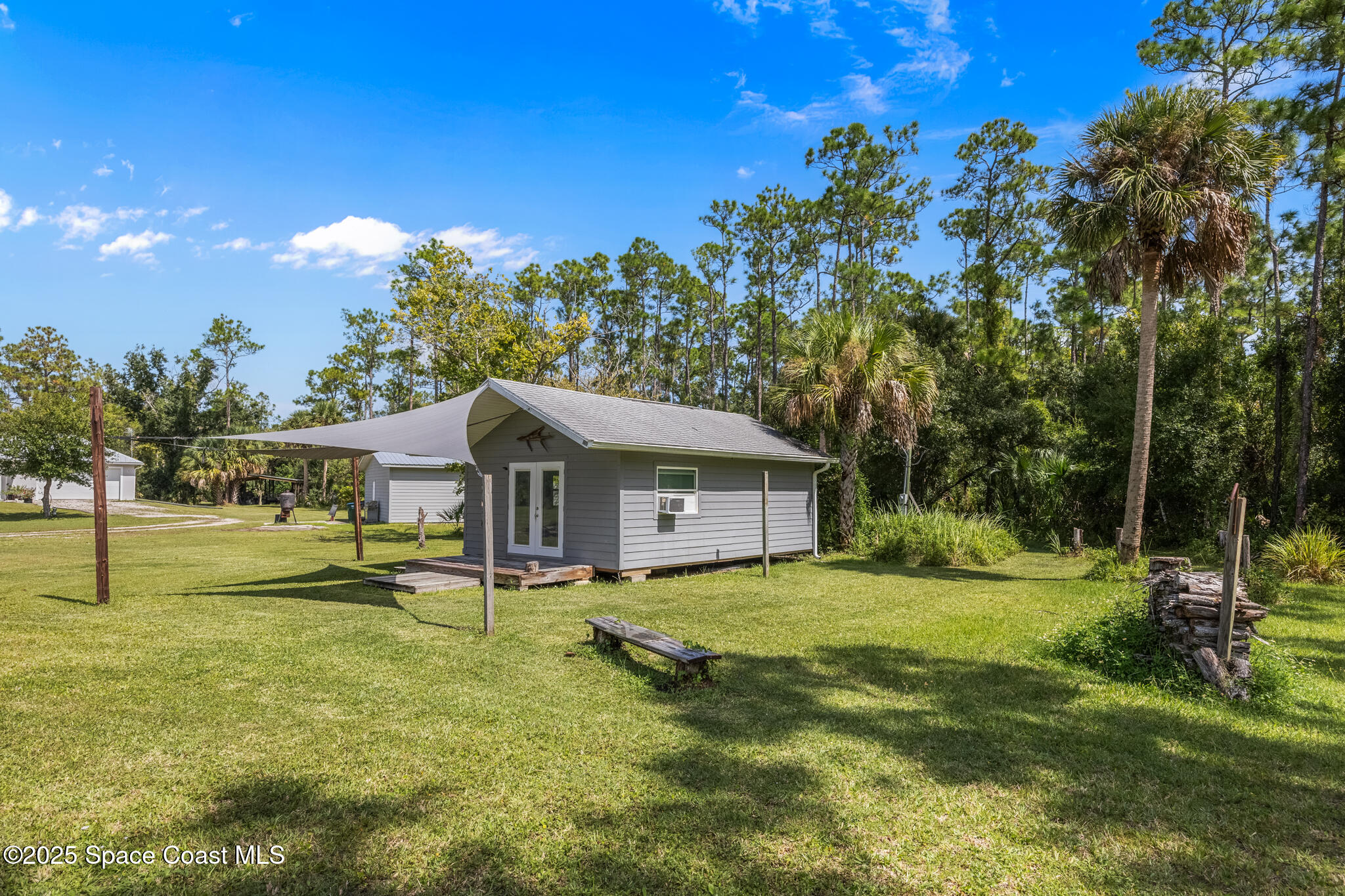 2050 Valkaria Road Grant-Valkaria, FL 32950 - Photo 40 of 56 a view of a house with a yard