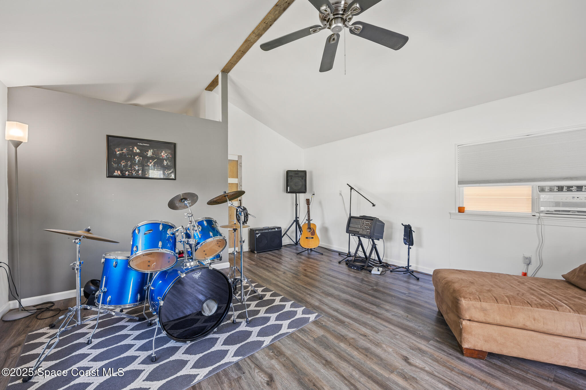2050 Valkaria Road Grant-Valkaria, FL 32950 - Photo 42 of 56 a living room with furniture and a wooden floor