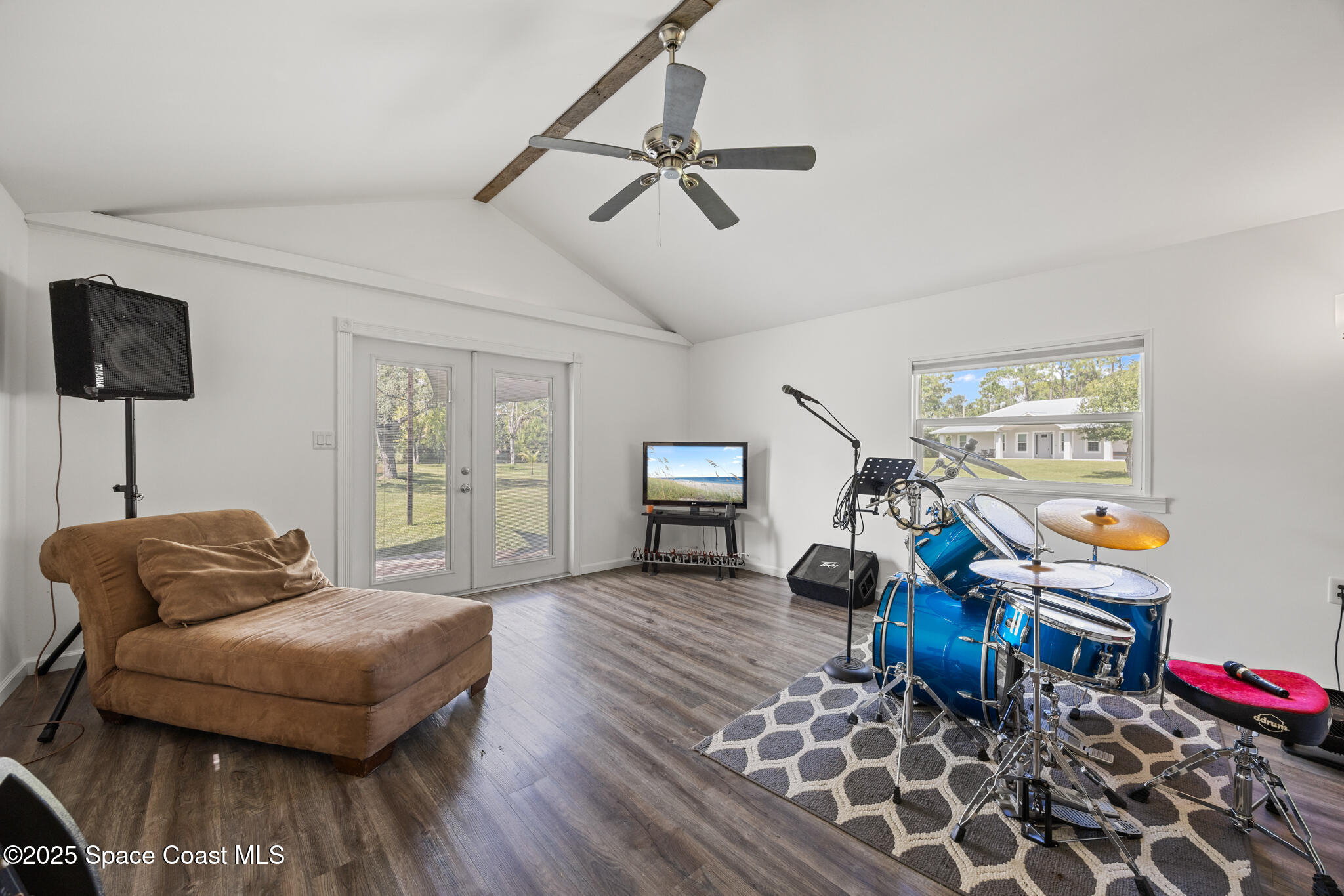 2050 Valkaria Road Grant-Valkaria, FL 32950 - Photo 43 of 56 a living room with furniture and a wooden floor