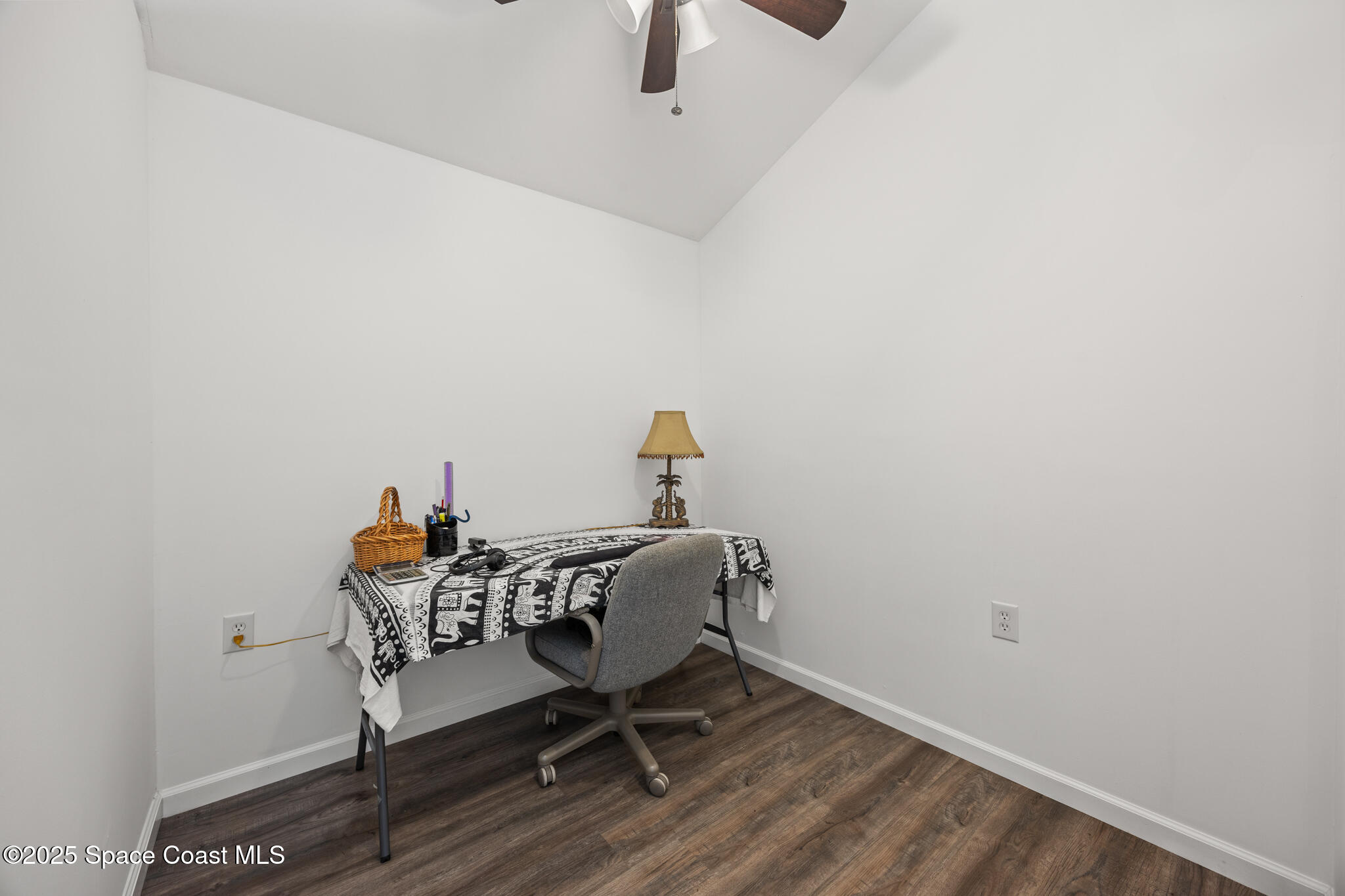 2050 Valkaria Road Grant-Valkaria, FL 32950 - Photo 44 of 56 a workspace with furniture and wooden floor