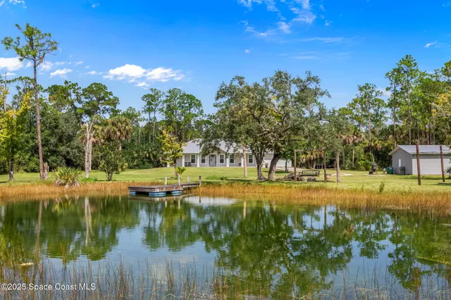 a view of a house with a big yard
