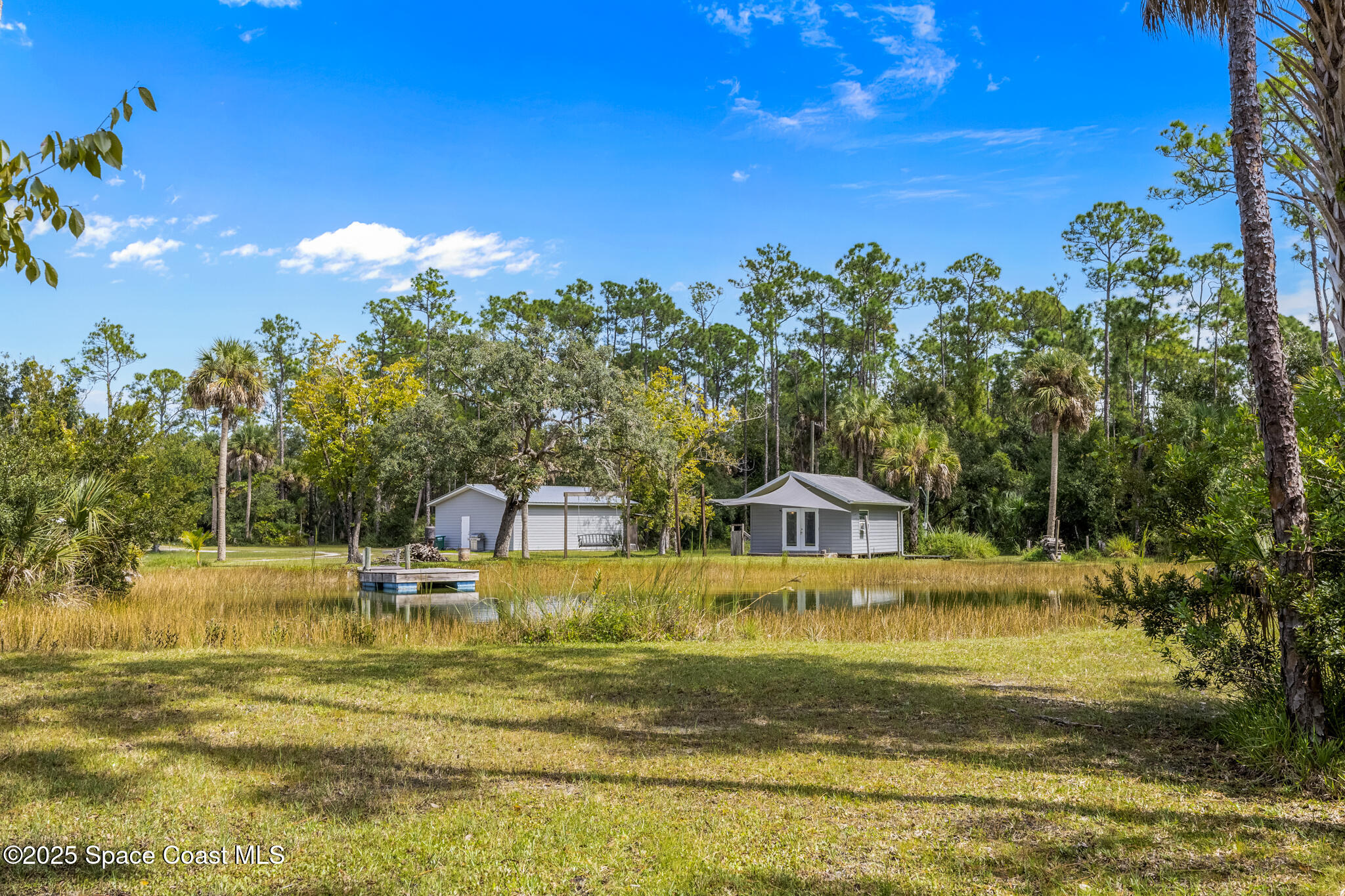 2050 Valkaria Road Grant-Valkaria, FL 32950 - Photo 48 of 56 a view of a house with a big yard