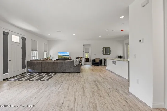 a living room with furniture and a table