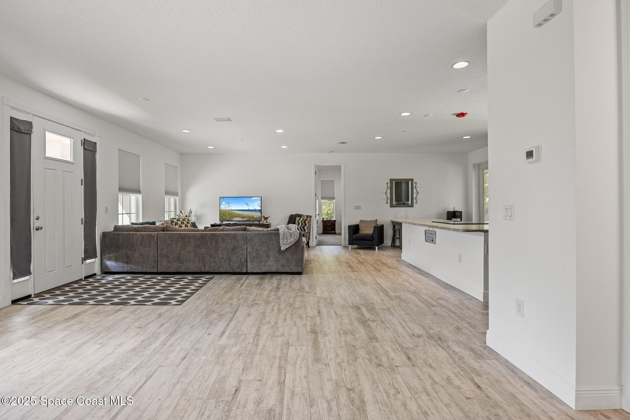 2050 Valkaria Road Grant-Valkaria, FL 32950 - Photo 6 of 56 a living room with furniture and a table