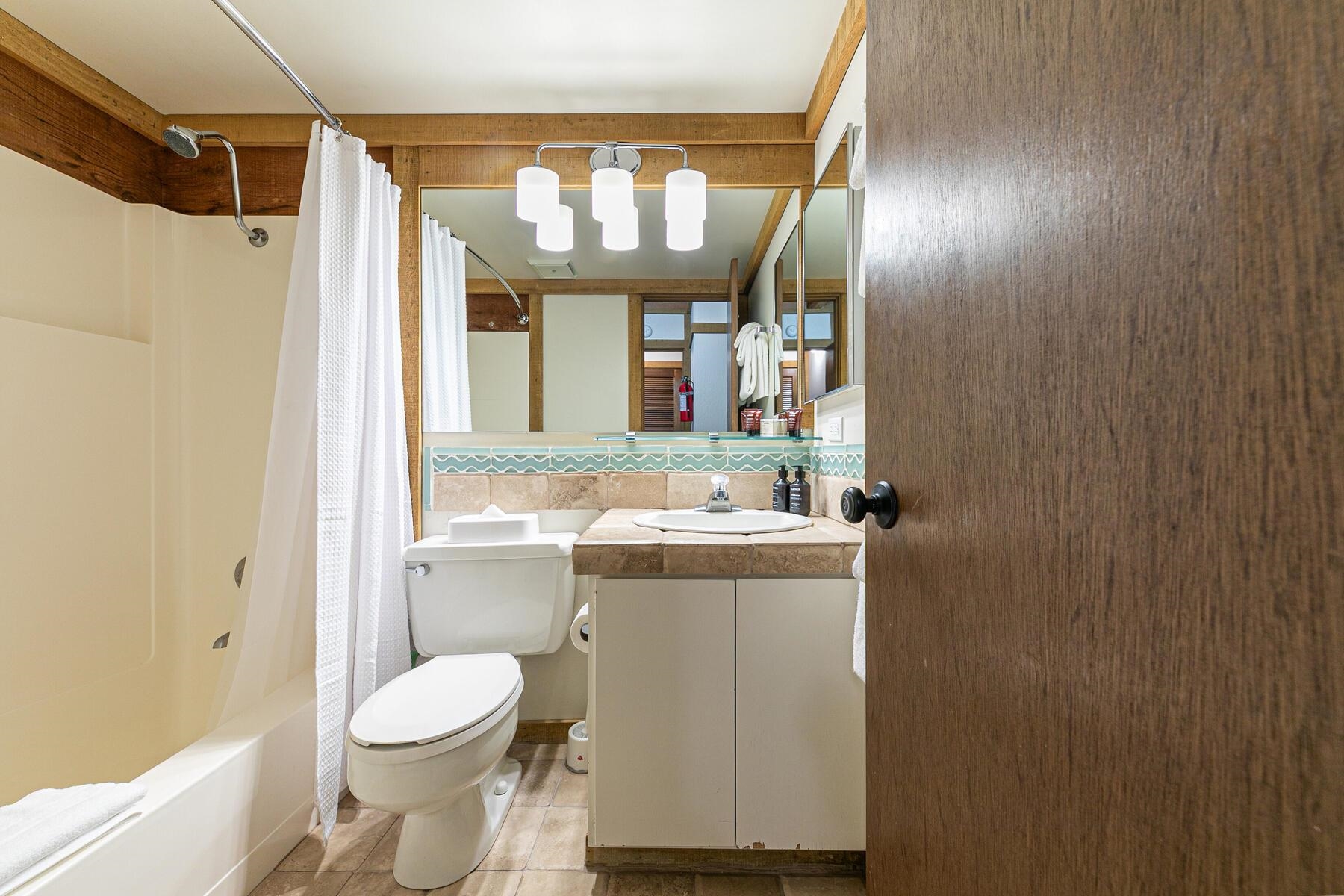5096 Gold Bend Truckee, CA 96161 - Photo 13 of 27 a bathroom with a granite countertop sink a toilet and shower