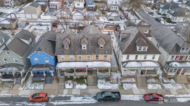 an aerial view of residential houses and city view