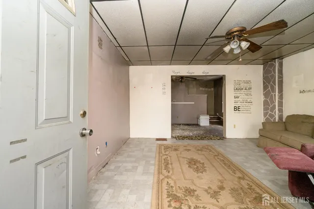 a living room with furniture and a rug