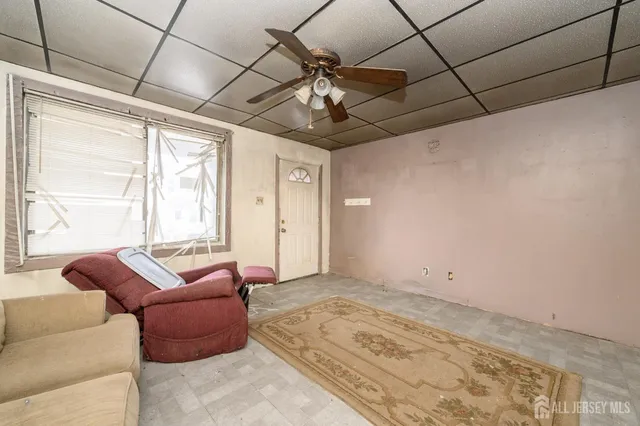 a room with a window and a chandelier