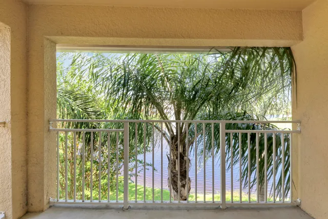 a view of a yard with wooden fence