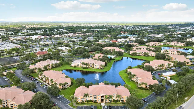 an aerial view of a residential houses with outdoor space