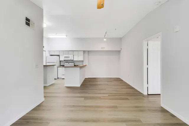 a view of kitchen with wooden floor