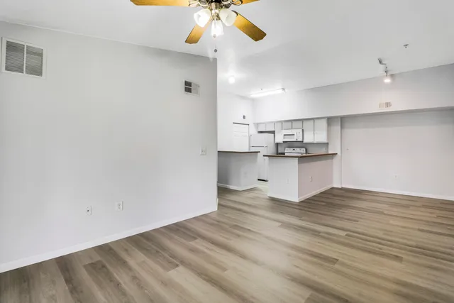 a view of kitchen with wooden floor and window