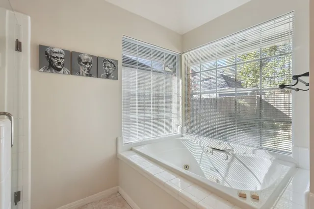 a bath tub sitting next to a window