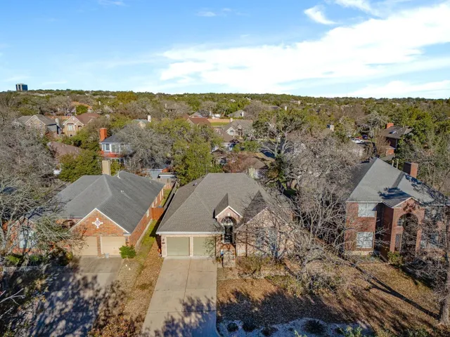 an aerial view of house with yard