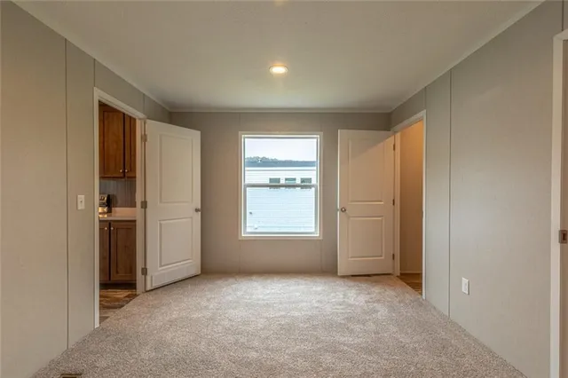 a view of empty room with windows