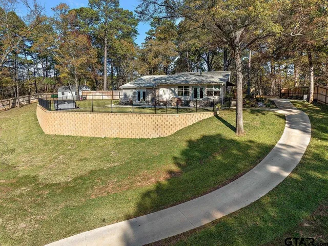 a view of a swimming pool with a patio